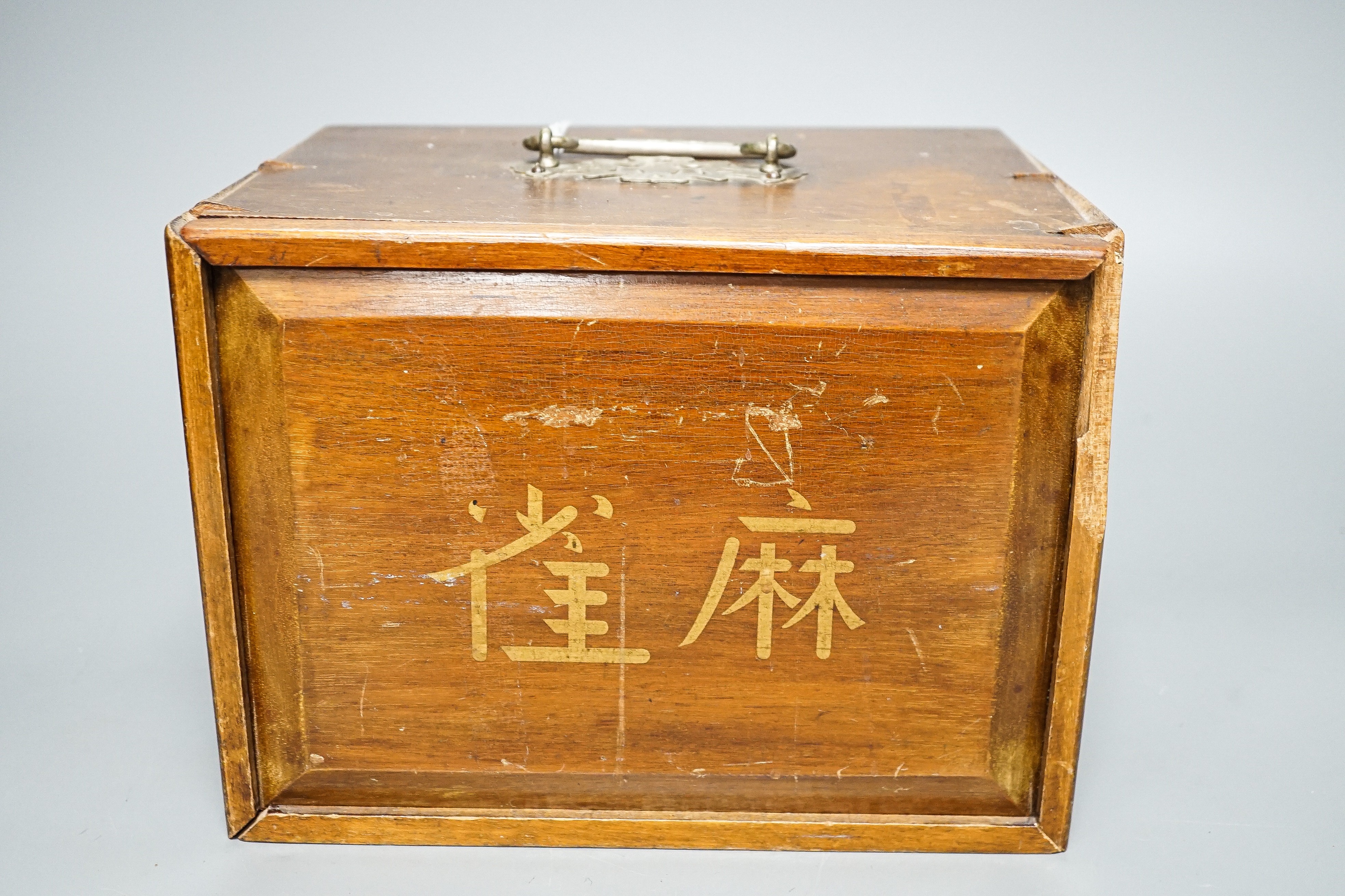 A Mah Jong set in wooden box, 17 cms high.